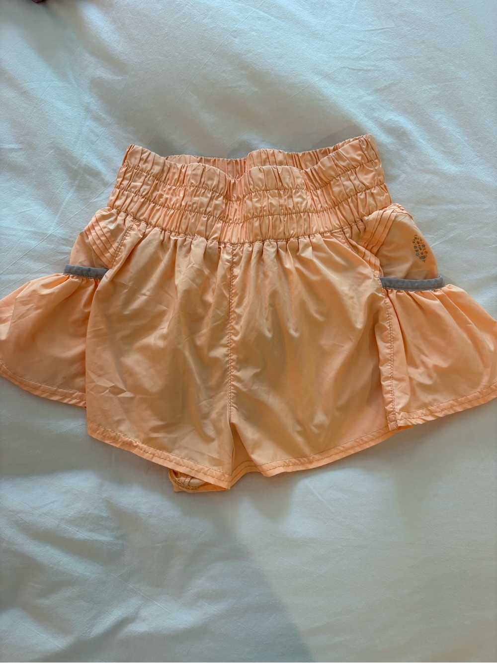 FP Movement by Free People Peach Smocked-Waist Athletic Shorts